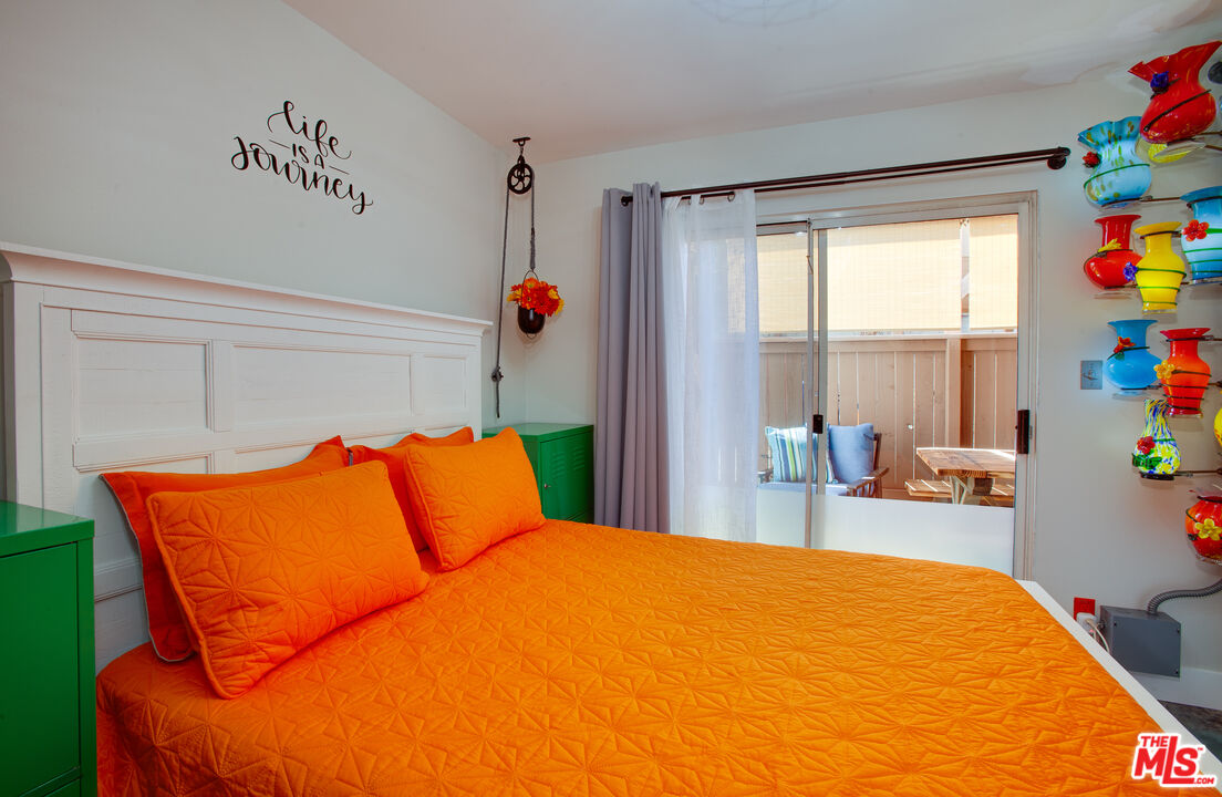 2912 11th Street, Unit 4 Santa Monica, CA 90405 - Photo 11 of 39 a bed sitting in a bedroom next to a window