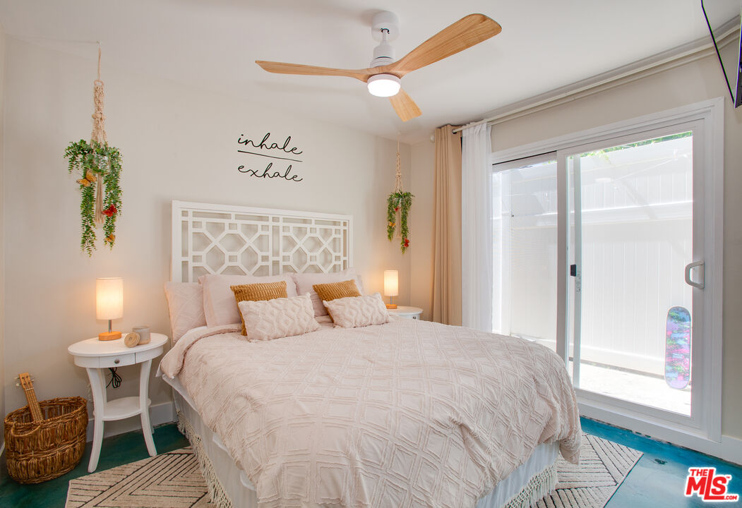 2912 11th Street, Unit 4 Santa Monica, CA 90405 - Photo 12 of 39 a bedroom with a bed and a table