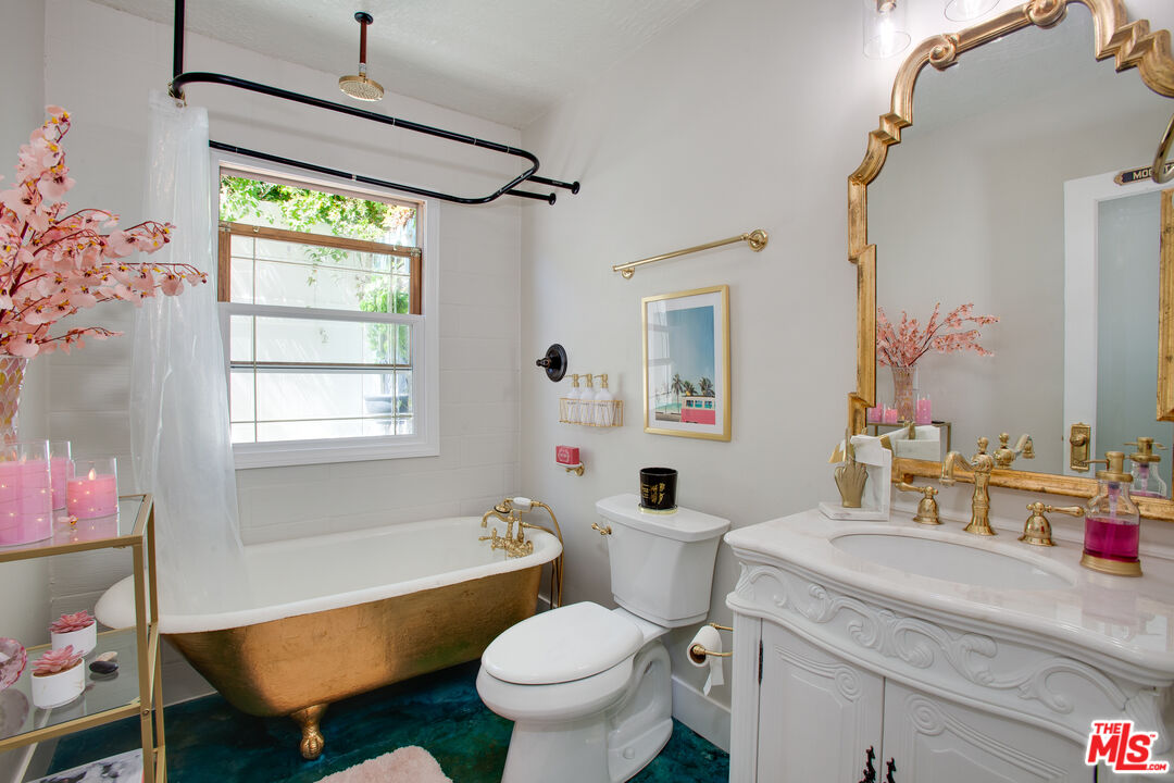 2912 11th Street, Unit 4 Santa Monica, CA 90405 - Photo 18 of 39 a bathroom with a toilet sink and mirror