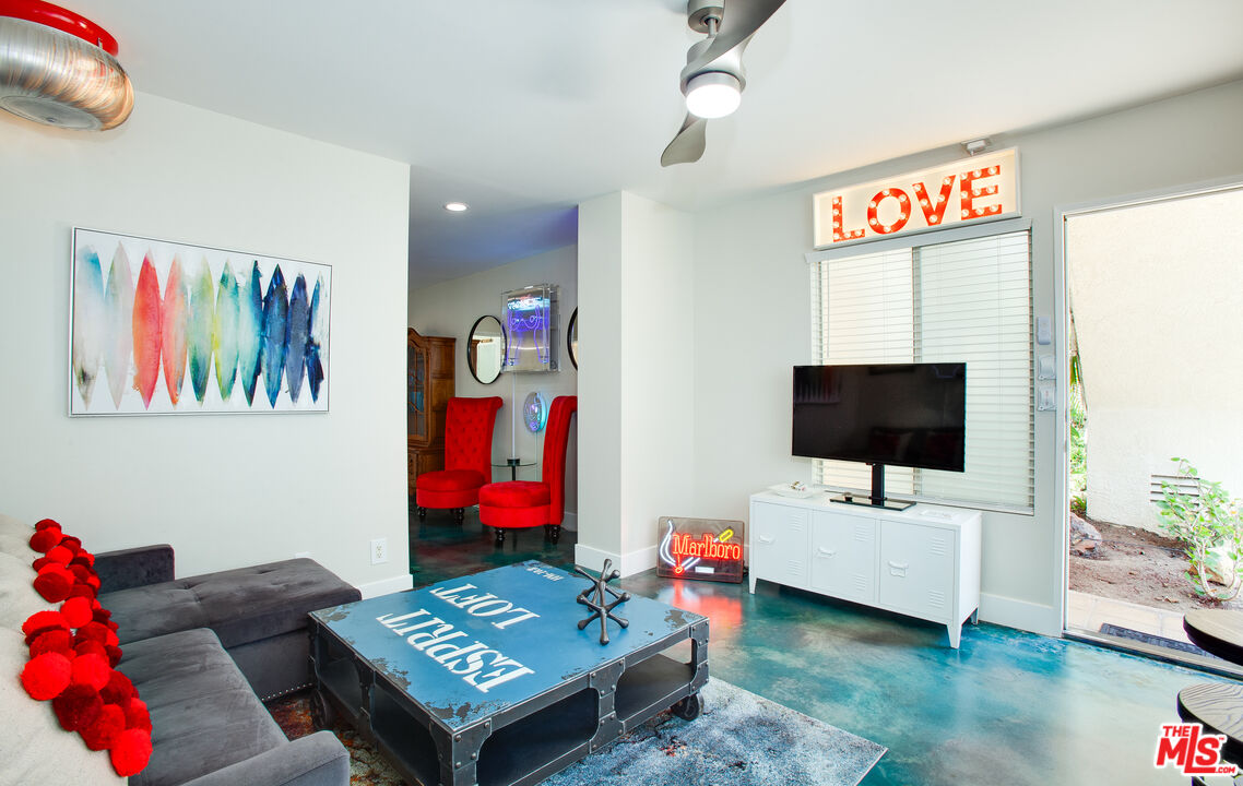 2912 11th Street, Unit 4 Santa Monica, CA 90405 - Photo 5 of 39 a living room with furniture and a flat screen tv