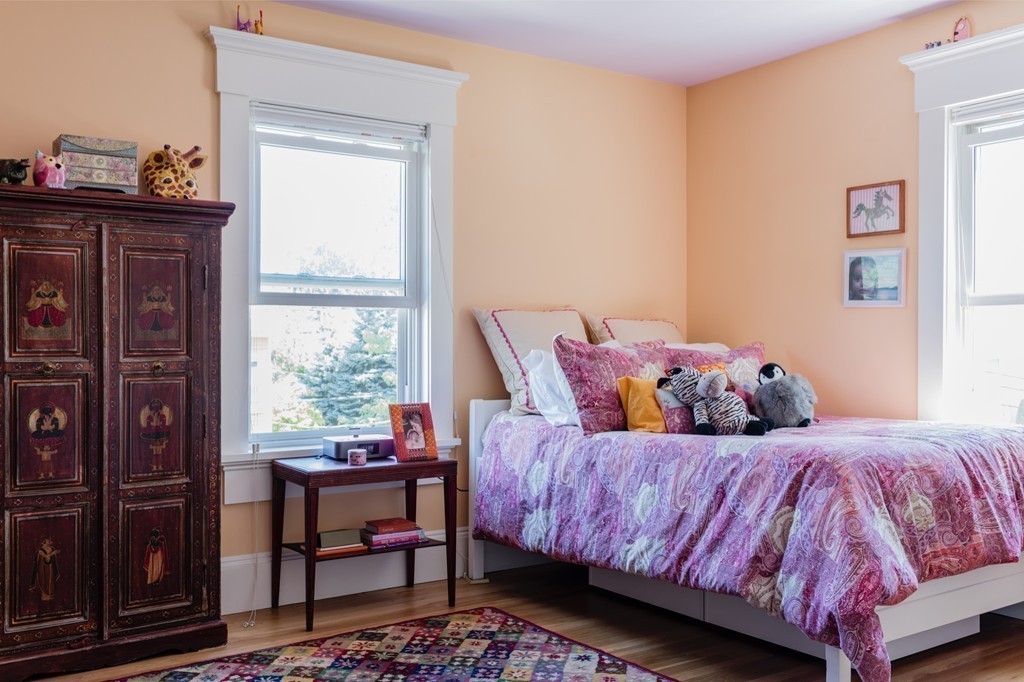 8 Vineyard Street Cambridge, MA 02138 - Photo 8 of 15 a bedroom with a bed and a window