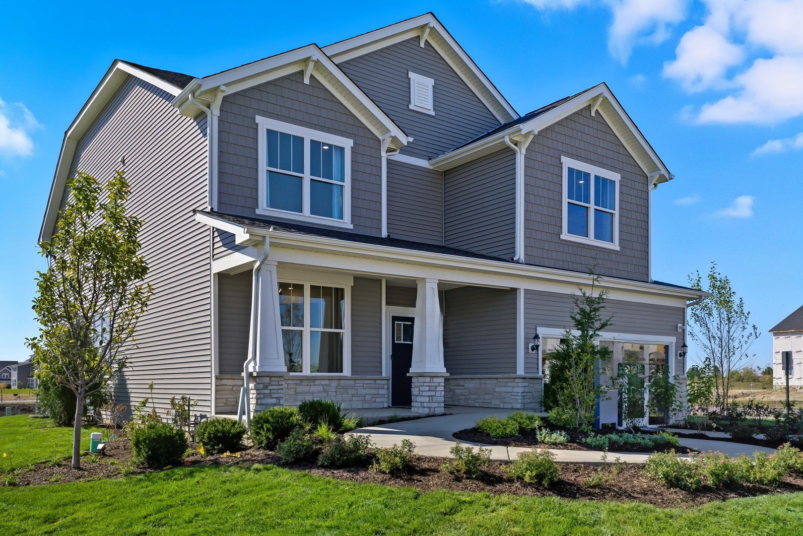 605 Redtop Way Bolingbrook, IL 60490 - Photo 1 of 22 a front view of a house with a yard and garage
