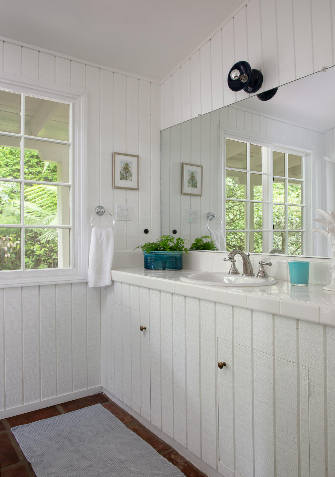 279 Santa Rosa Lane Montecito, CA 93108 - Photo 18 of 27 a bathroom with a sink and a large mirror