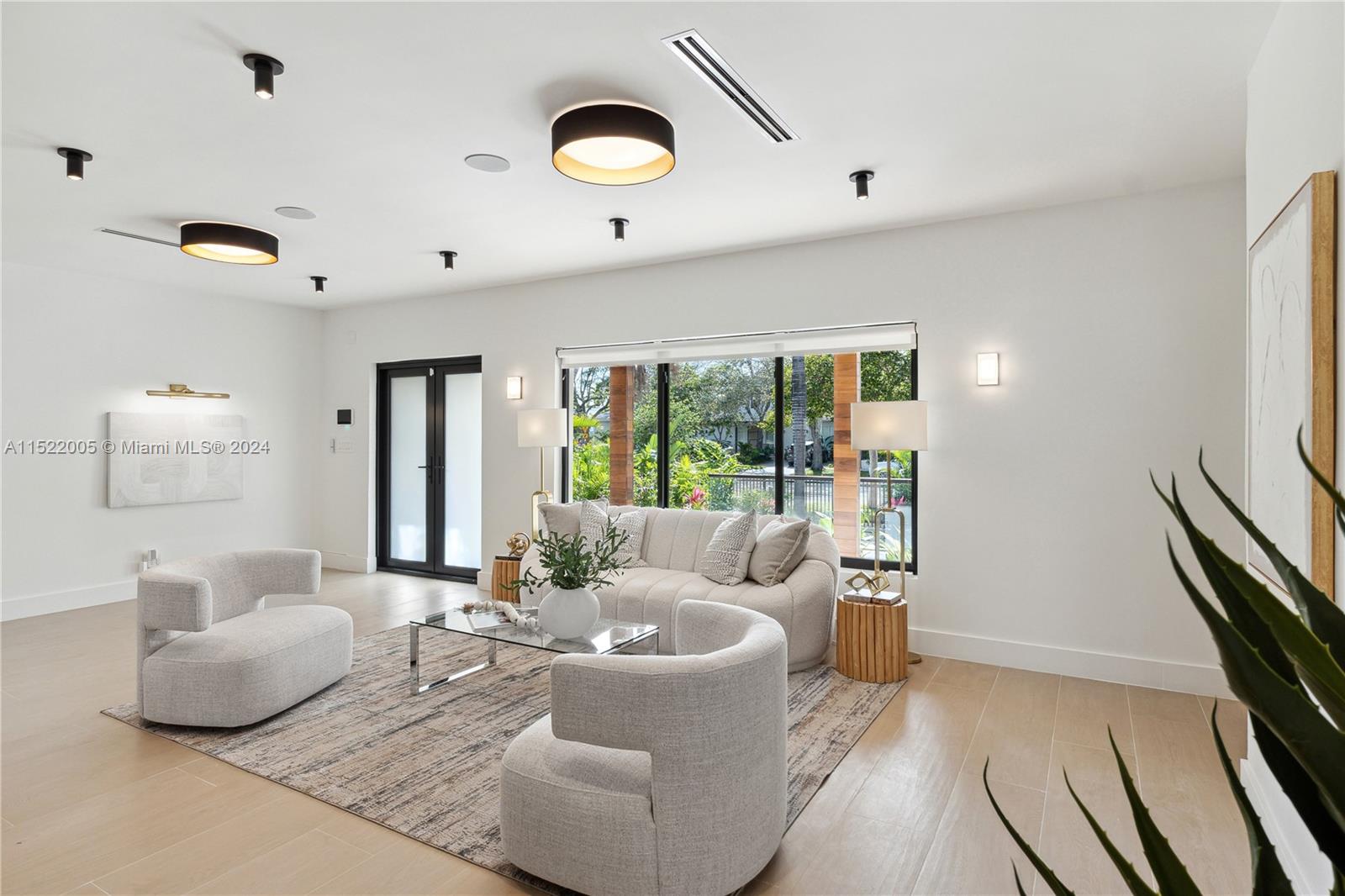 519 Southwest 25th Road Miami, FL 33129 - Photo 11 of 43 a living room with furniture and a large window