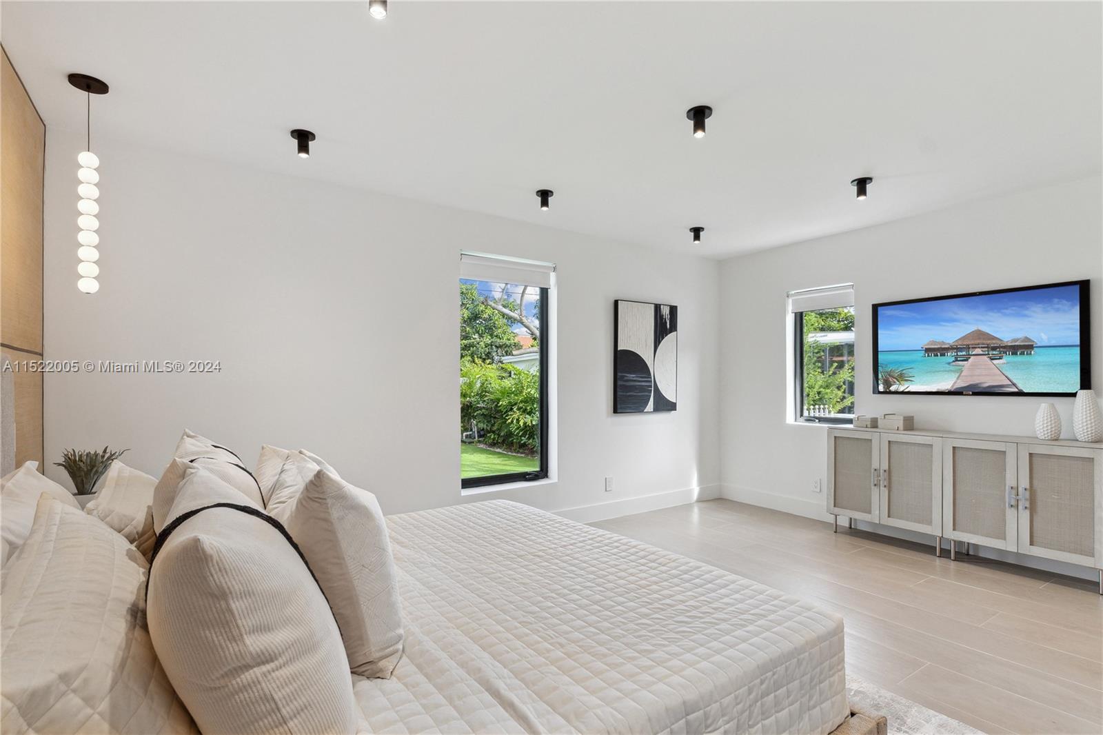 519 Southwest 25th Road Miami, FL 33129 - Photo 14 of 43 a view of a bedroom with furniture and window
