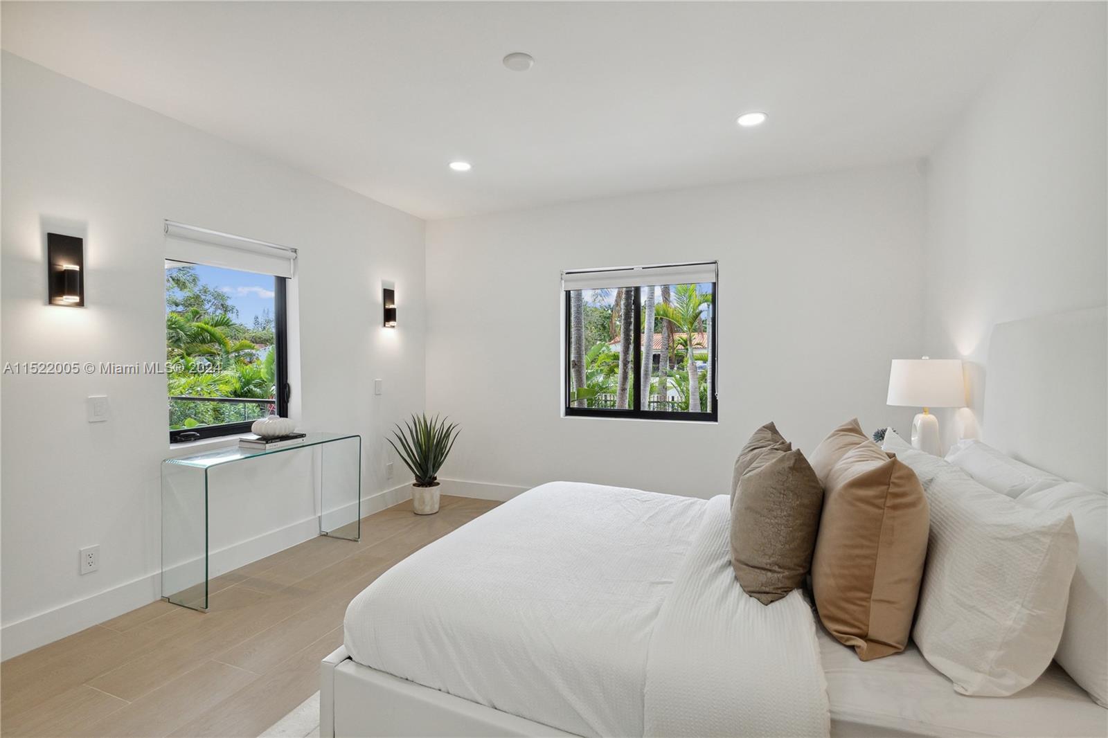 519 Southwest 25th Road Miami, FL 33129 - Photo 20 of 43 a bedroom with a large bed and a window