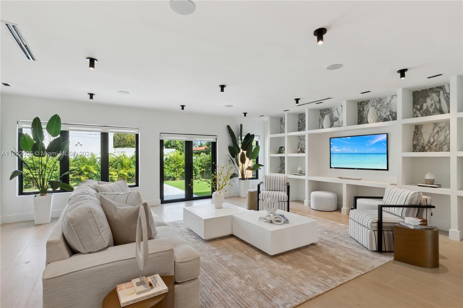 519 Southwest 25th Road Miami, FL 33129 - Photo 2 of 43 a living room with furniture and a large window