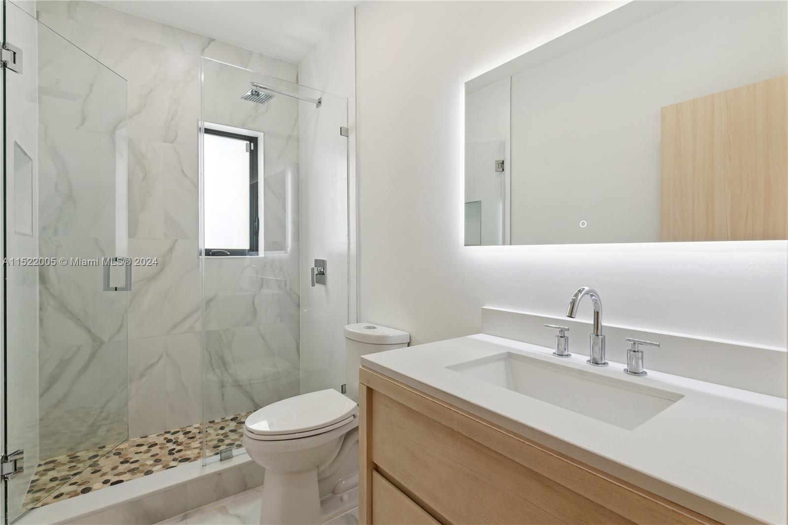 519 Southwest 25th Road Miami, FL 33129 - Photo 25 of 43 a bathroom with a sink a toilet and shower