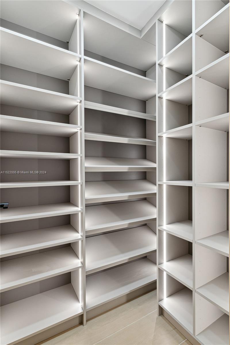 519 Southwest 25th Road Miami, FL 33129 - Photo 26 of 43 a view of walk in closet with empty racks