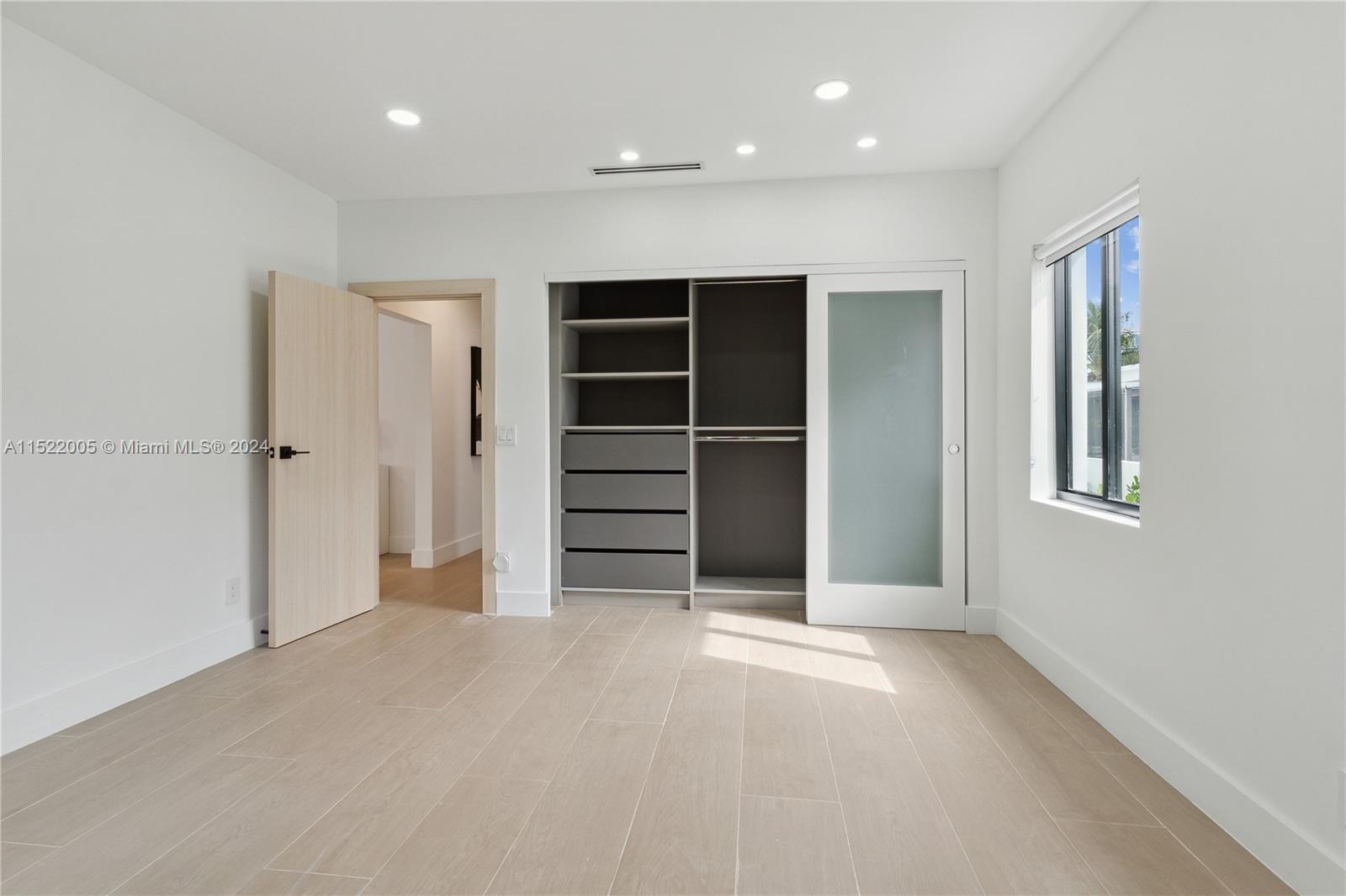 519 Southwest 25th Road Miami, FL 33129 - Photo 27 of 43 a view of an empty room with a window