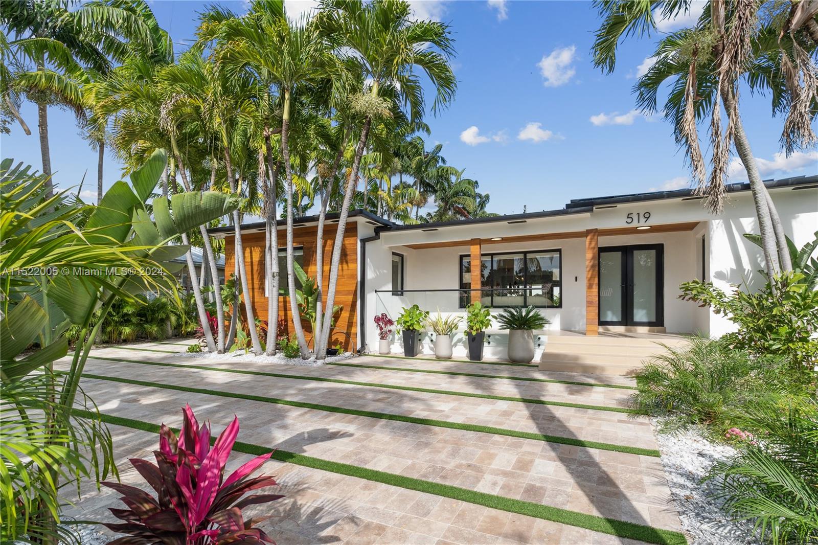 519 Southwest 25th Road Miami, FL 33129 - Photo 3 of 43 a front view of a house with garden