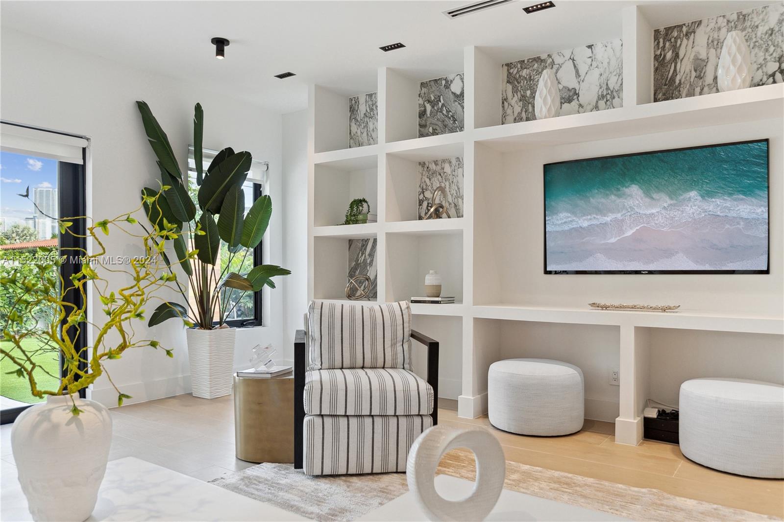 519 Southwest 25th Road Miami, FL 33129 - Photo 8 of 43 a living room with furniture a potted plant and a window
