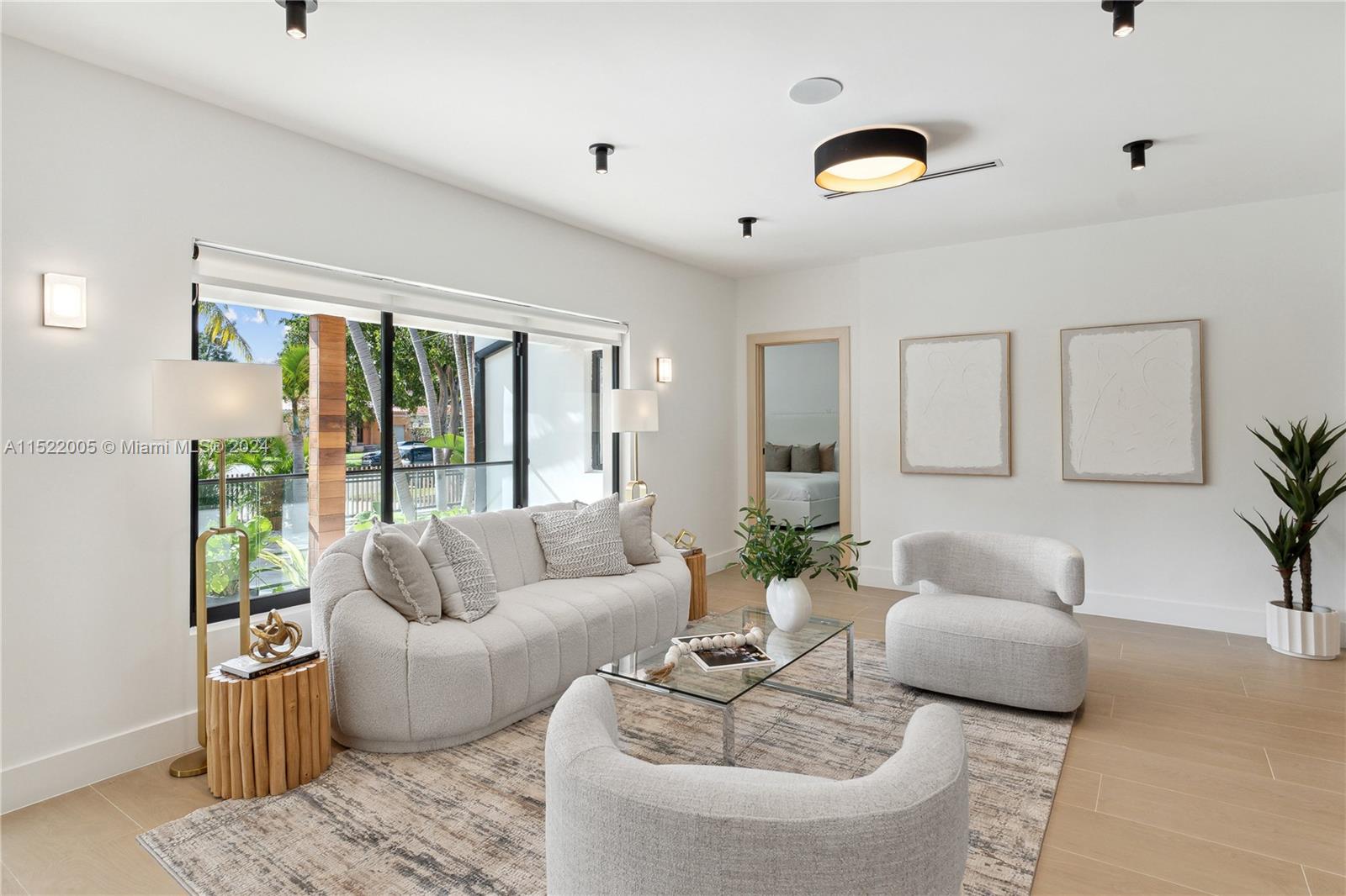 519 Southwest 25th Road Miami, FL 33129 - Photo 10 of 43 a living room with furniture and a large window