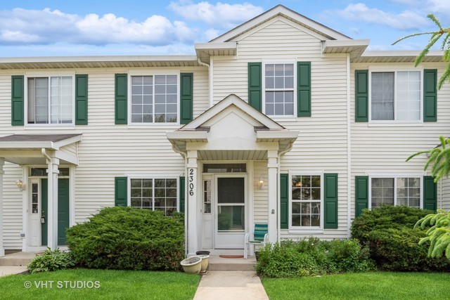 front view of a house and a yard