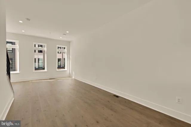a view of a room with gym equipment and windows