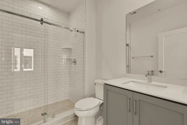 a view of an empty room with windows