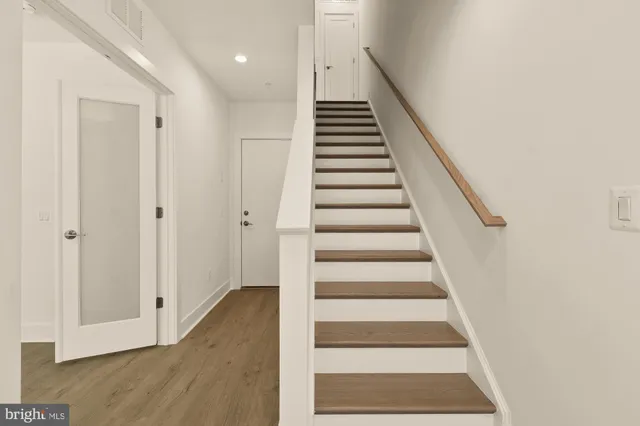 a view of entryway with wooden floor