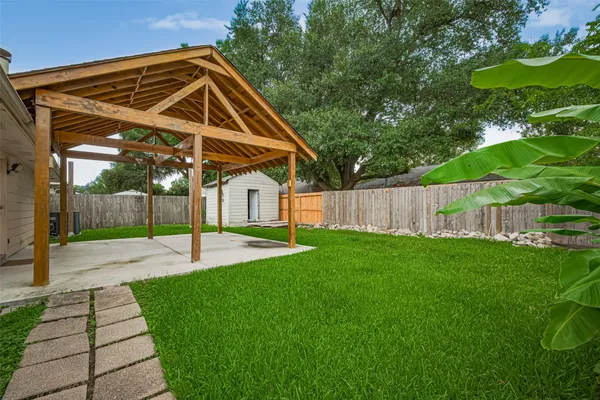 a view of a backyard with a swimming pool