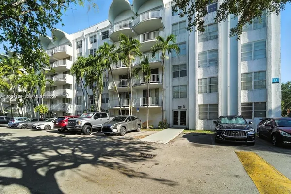 a building with cars parked in front of it