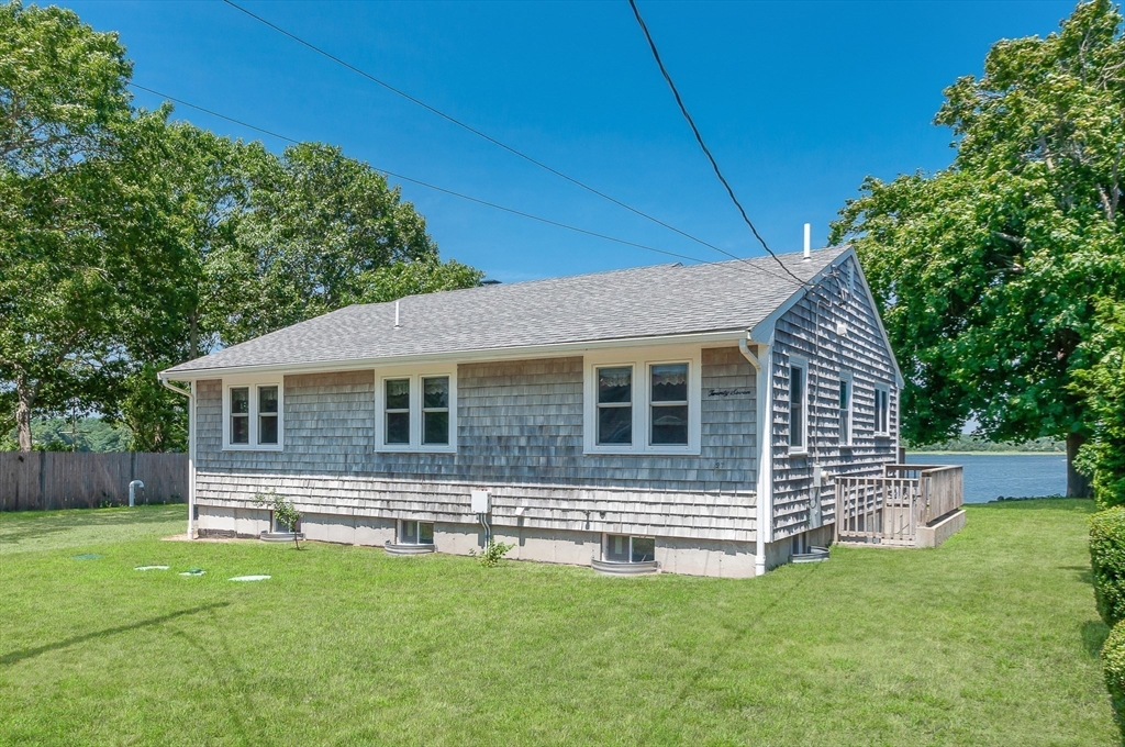 27 Over Jordan Road Wareham, MA 02571 - Photo 14 of 28 a front view of house with yard and green space