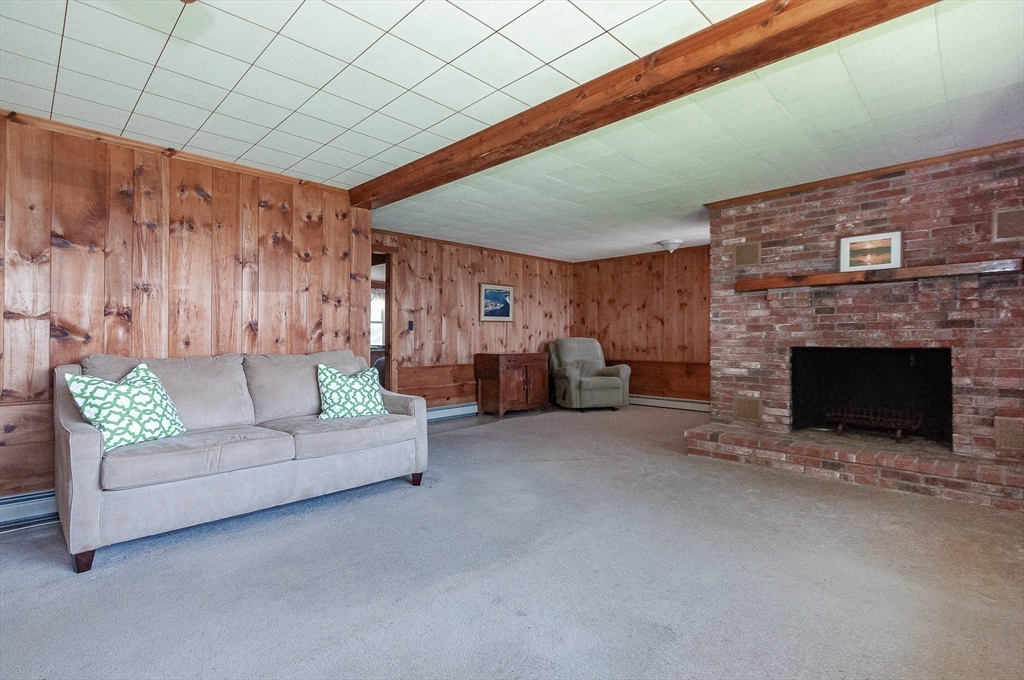 27 Over Jordan Road Wareham, MA 02571 - Photo 20 of 28 a living room with furniture and a fireplace