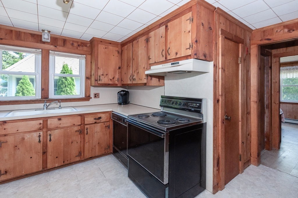 27 Over Jordan Road Wareham, MA 02571 - Photo 22 of 28 a kitchen with stainless steel appliances granite countertop a stove a sink and a microwave