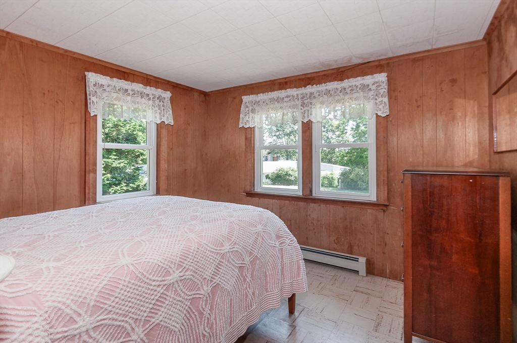 27 Over Jordan Road Wareham, MA 02571 - Photo 24 of 28 a bed sitting in a bedroom next to a window