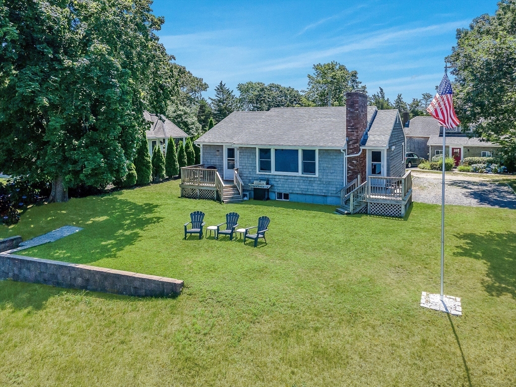27 Over Jordan Road Wareham, MA 02571 - Photo 6 of 28 a view of a house with a yard porch and sitting area