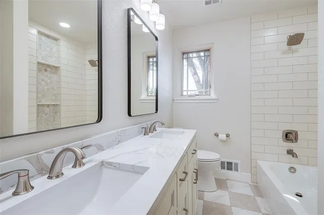 an empty room with closet and a ceiling fan