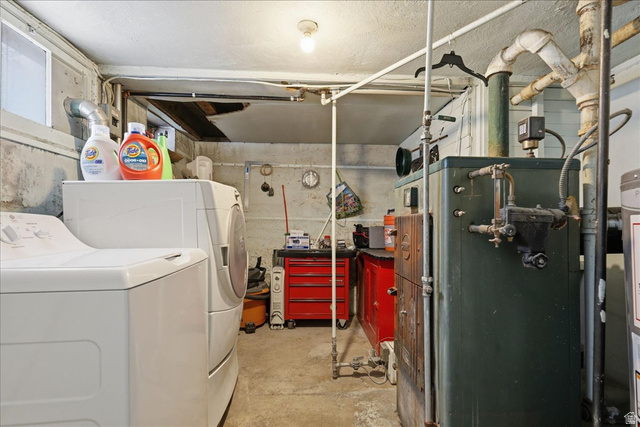 348 East 200 North Logan, UT 84321 - Photo 41 of 41 Utility space featuring a washer and dryer, concrete flooring, and exposed mechanical systems