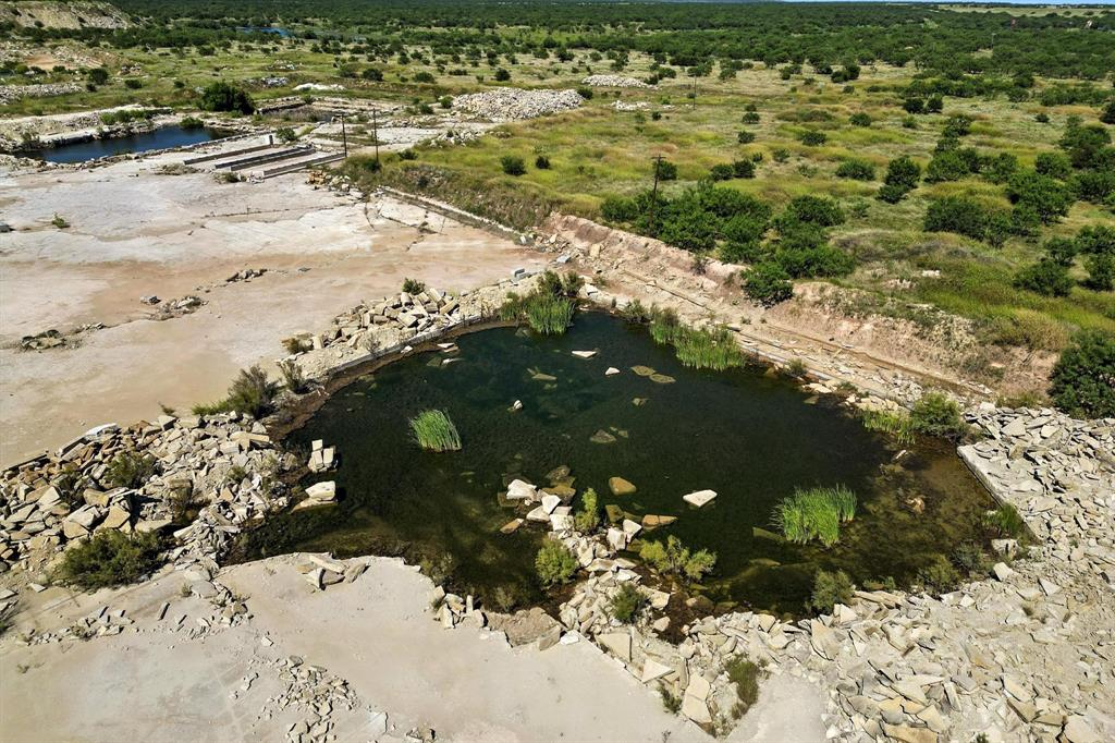 567 Hendrick Ranch Road Lueders, TX 79533 - Photo 16 of 39 a view of a yard with a tree