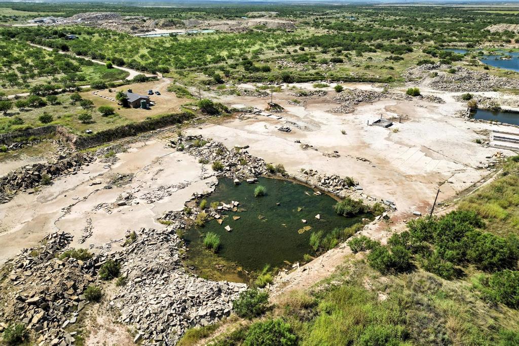 567 Hendrick Ranch Road Lueders, TX 79533 - Photo 17 of 39 a view of a yard with parking space