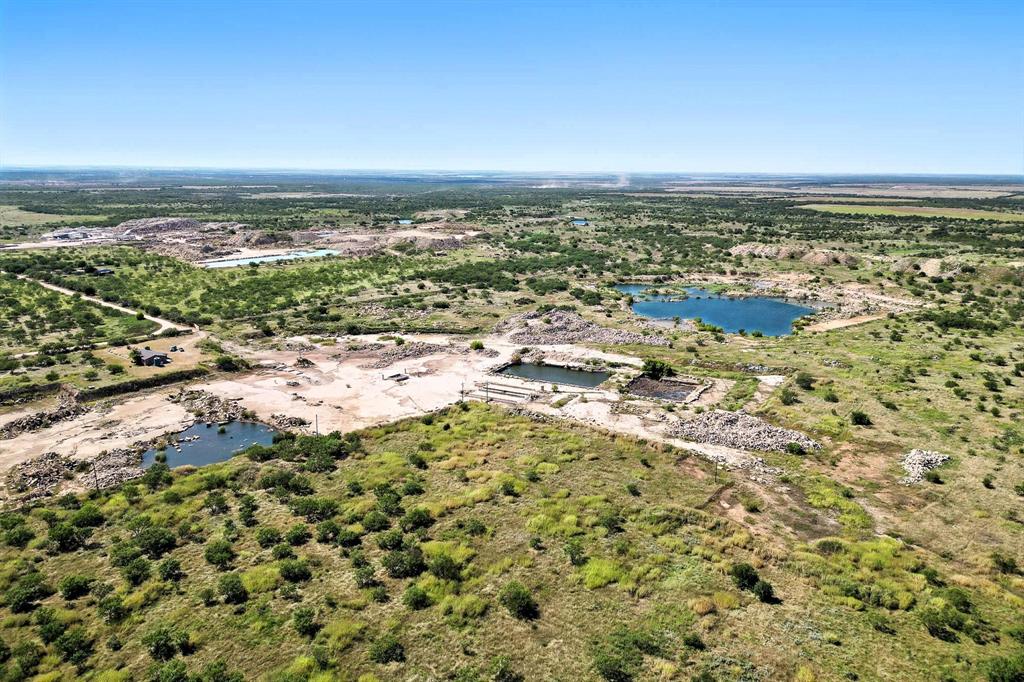 567 Hendrick Ranch Road Lueders, TX 79533 - Photo 23 of 39 an aerial view of residential building and ocean