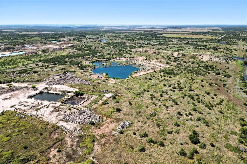 567 Hendrick Ranch Road Lueders, TX 79533 - Photo 25 of 39 an aerial view of residential houses with outdoor space