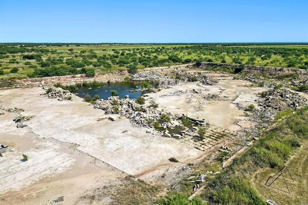 567 Hendrick Ranch Road Lueders, TX 79533 - Photo 3 of 39 a view of a yard with an outdoor space