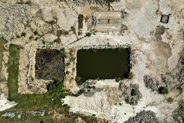 an aerial view of a houses with a yard