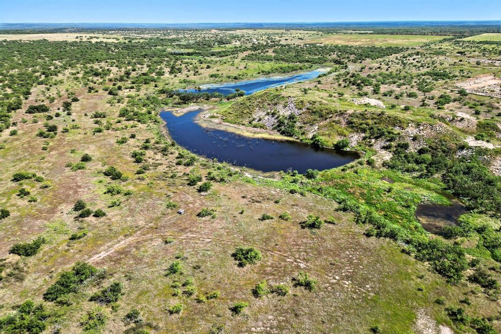 567 Hendrick Ranch Road Lueders, TX 79533 - Photo 10 of 39 a view of a lake with a mountain view