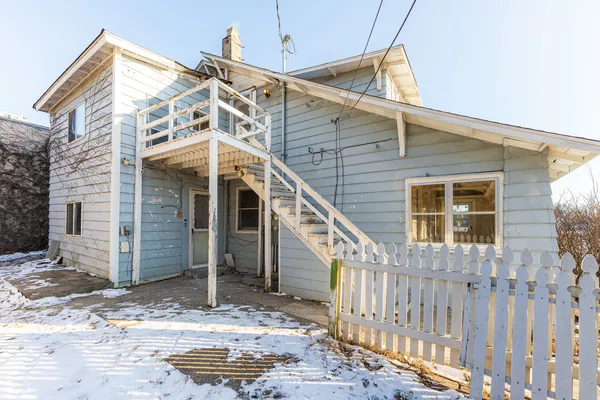 a view of a house with a small yard