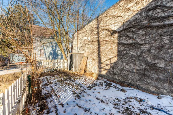 a view of a yard covered with snow