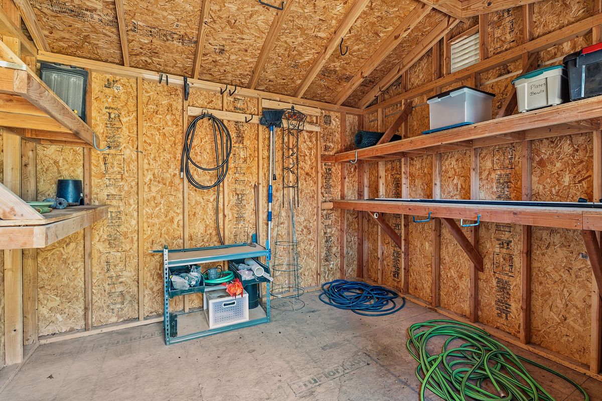 2002 Terry Lane Georgetown, TX 78628 - Photo 33 of 34 Large storge shed with shelving - workbench also in garage