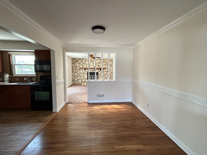 2724 Hickory Road Union, NJ 07083 - Photo 5 of 16 an empty room with wooden floor and a window