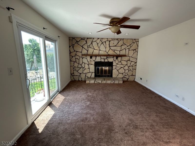 2724 Hickory Road Union, NJ 07083 - Photo 7 of 16 an empty room with windows and fireplace