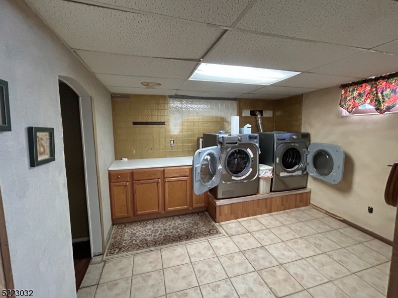 2724 Hickory Road Union, NJ 07083 - Photo 9 of 16 a utility room with sink dryer and washer