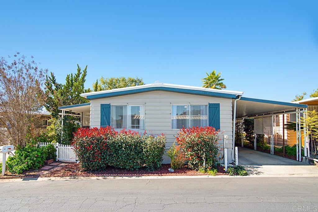 1120 East Mission Road, Unit 10 Fallbrook, CA 92028 - Photo 1 of 1 a front view of a house with a porch