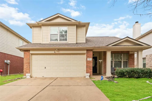 a front view of a house with yard