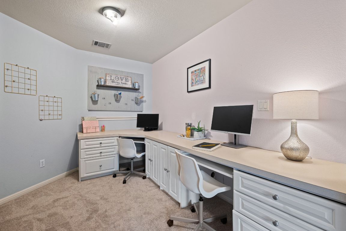 3209 Indigo Waters Drive Austin, TX 78732 - Photo 23 of 40 a view of a workspace with furniture