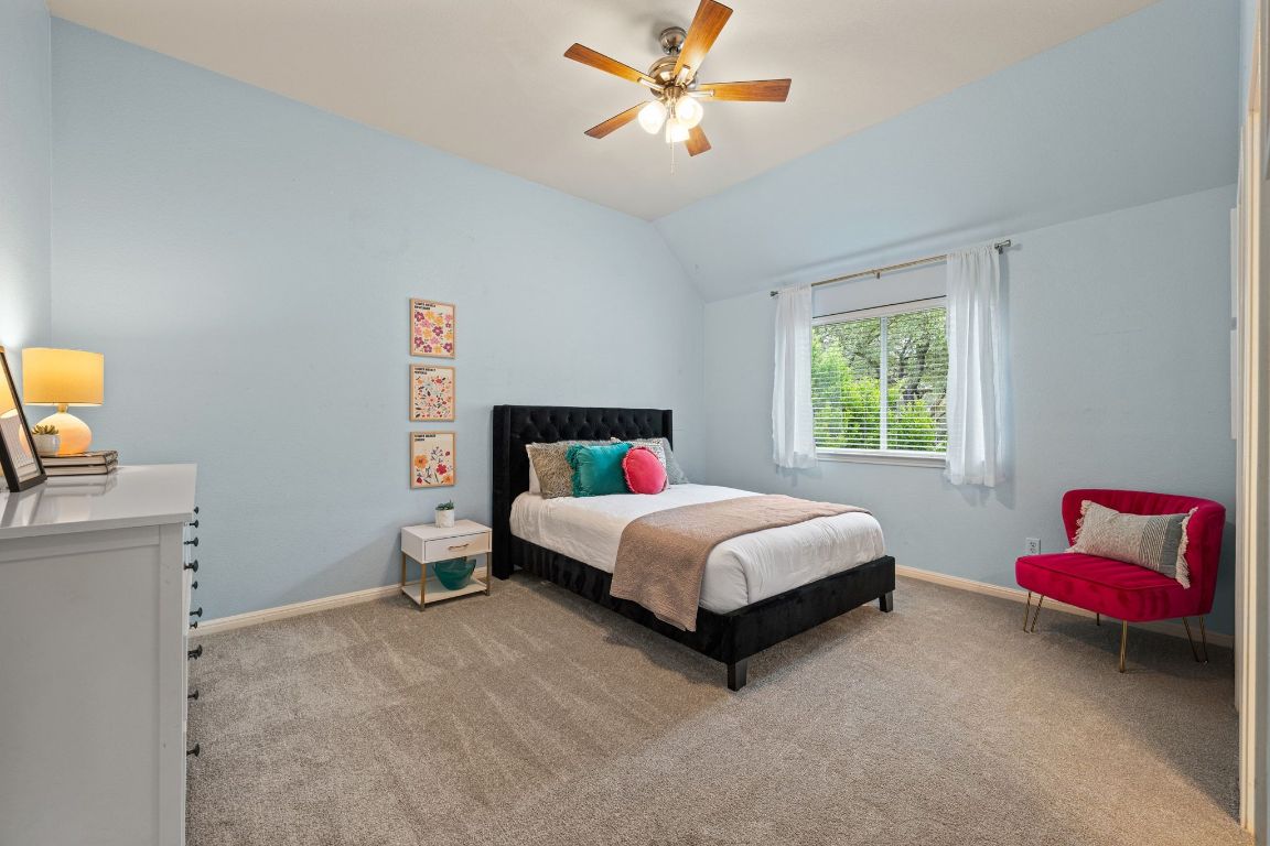 3209 Indigo Waters Drive Austin, TX 78732 - Photo 26 of 40 a bedroom with a bed and a window