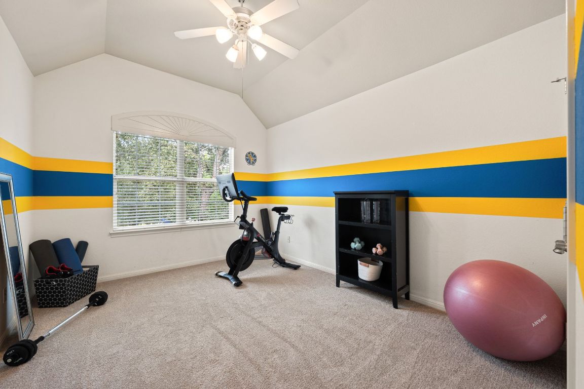 3209 Indigo Waters Drive Austin, TX 78732 - Photo 27 of 40 a living room with furniture and a flat screen tv