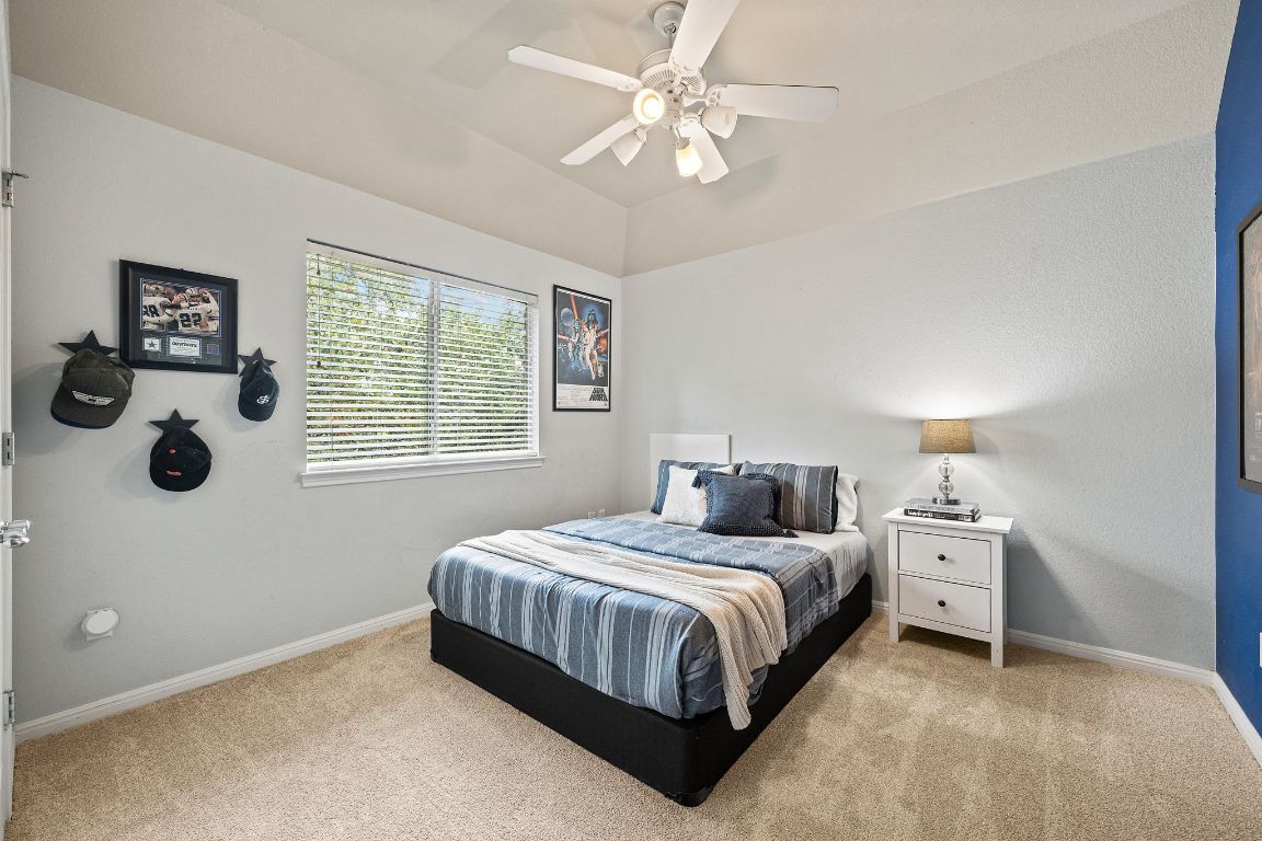 3209 Indigo Waters Drive Austin, TX 78732 - Photo 29 of 40 a bedroom with a bed and a window