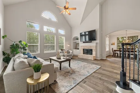 a living room with furniture fireplace and flat screen tv
